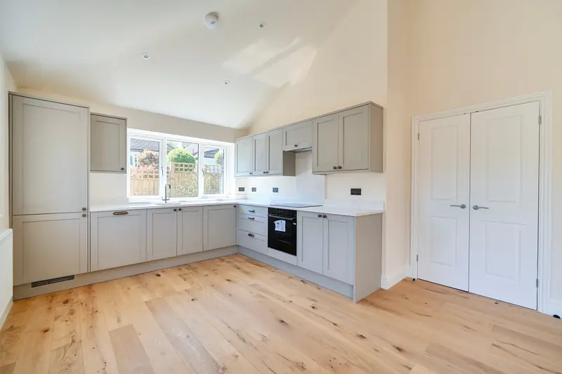 Kitchen with vaulted ceiling and integrated appliances