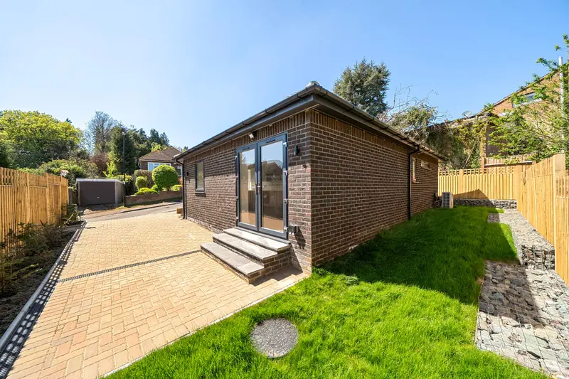 Rear patio and L-shaped garden