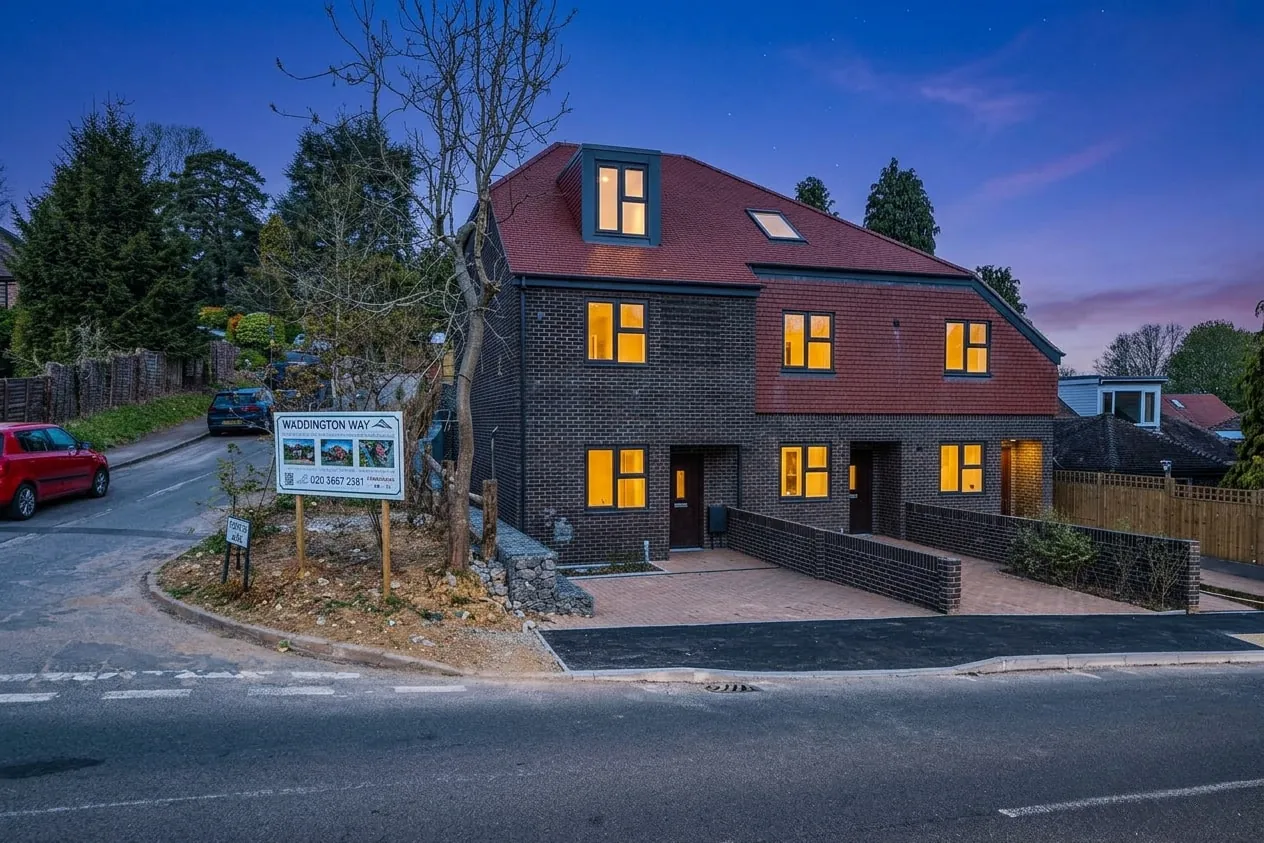 The terrace of three homes, 109A, 109B and 109C Waddington Avenue, at dusk