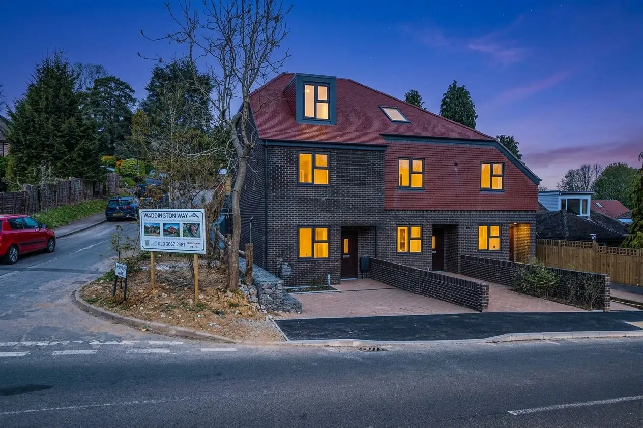 The terrace of three homes, 109A, 109B and 109C Waddington Avenue, at dusk
